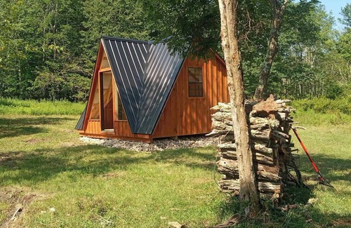 Mount Storm Cabin | Waterfront Glamping Cabin On Private Blue Water Mountain Top Lake