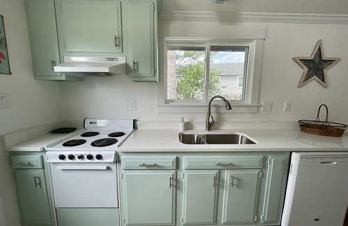 Colington Harbour Cottage | Waterfront Harbor Home, Sunset Views, Fireplace, Private dock and Boat Slip