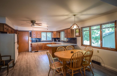 Onekama House | Waterfront home on Portage Lake with lake-view deck & firepit