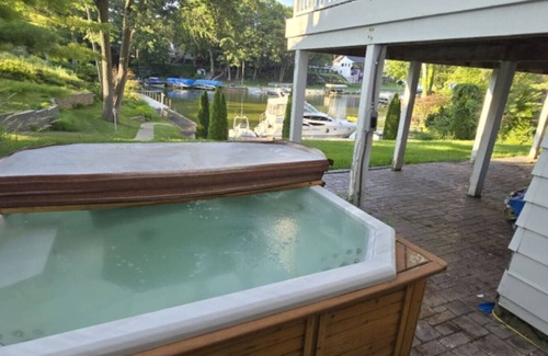 Spring Lake House | Waterfront home Spring Lake hot tub, firepit, gas grill fishing