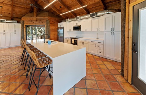 Longbeach Village House | Waterfront home with private beach, a private pool, and water activities! Moku