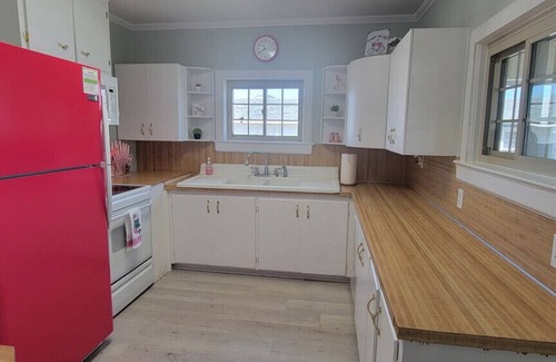 Cedar Point House | Waterfront home with Private Dock, 3 miles to Beach, Hot tub, kayaks, and swimming area, large fenced backyard, pet friendly