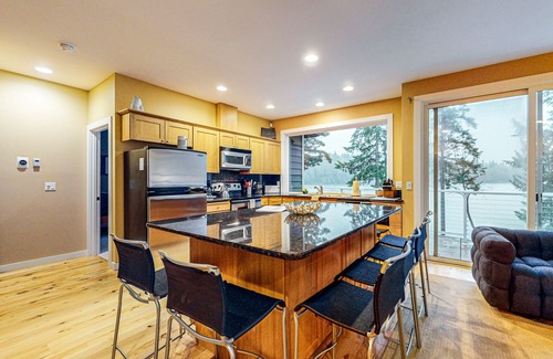 Shelton House | Waterfront home with private hot tub, patio, games, & gym room