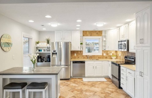 Colington Harbour House | Waterfront! HotTub, Game Room, Kayaks, SUPs, FirePit, YMCA! Theater Room, DogsOK