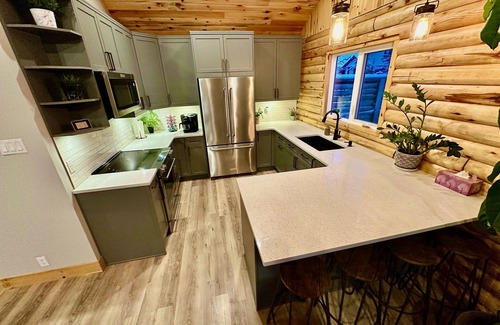 St. Andrews House | Waterfront Log Home with Beach and Hot Tub. Pet Friendly!