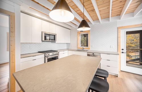 Scottville House | Waterfront Nordic Lodge on All Sports Lake, come with the whole family.