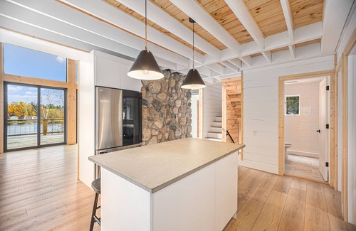 Scottville House | Waterfront Nordic Lodge on All Sports Lake, come with the whole family.