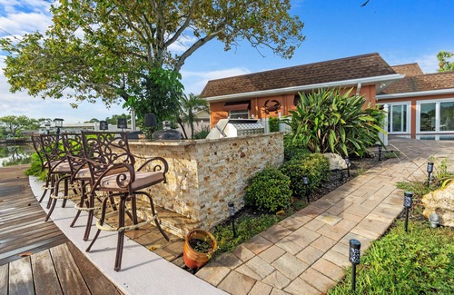 Harbor Hills House | Waterfront Oasis w/Pool, Spa, Boat & Jet ski Dock, Game Room & Outdoor Kitchen