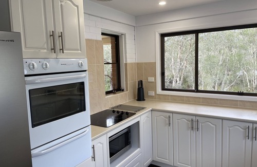 Dora Creek House | Waterfront Paradise with Jetty, Kayaks, BBQ, & more