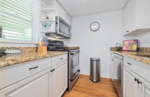 Dunedin Condo | Waterfront Price Reduced! Stunning 2nd story views of Sunsets and Marine Wildlife! Heated Pool!