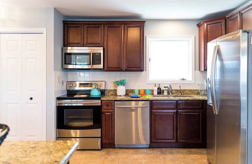 White Stone House | Waterfront Retreat w/Hot Tub, Game Room, Kayaks, 2 Kings, + more!