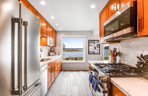 Lakebay House | Waterfront retreat with private beach, cookhouse, hot tub, EV charger, & firepit