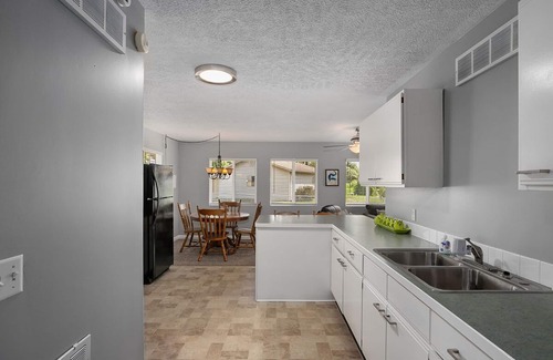 Newaygo Condo | Waterfront Suite: Dock, Kayaks, Firepit, BBQ