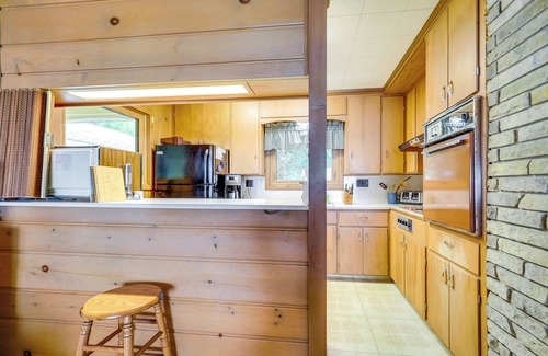 Central Lake Cottage | Waterfront Torch Lake Cottage w/Dock & Fire Pit!