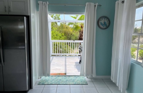 Discovery Bay Villa | Waterfront Villa with Dockside Patio, Paddleboards & Pontoon Boat Rental option