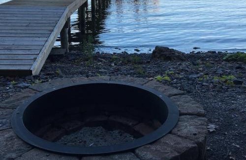 Geneva House | Waters Edge Lakefront with Kayaks Fire Pit and Dock