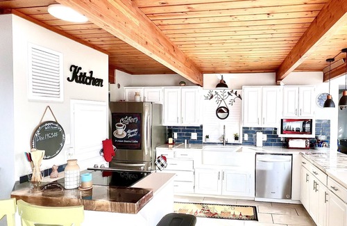 Center Ridge House | Watershed Getaway on lake, mountain behind house on property, and hiking trails