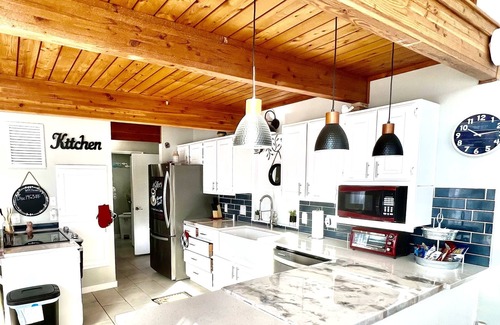 Center Ridge House | Watershed Getaway on lake, mountain behind house on property, and hiking trails