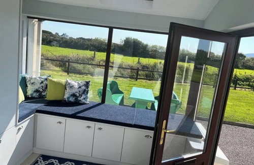 Waterville House | Waterville Luxury: 4BR Retreat Steps from Beach, Golf & Scenic Views