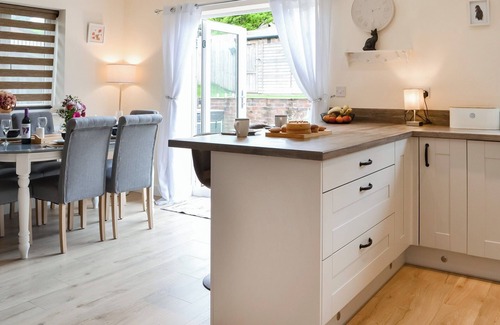 Langtoft Cottage | We love the open plan living area with wood burner.