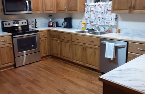 Madison Heights House | Welcome Home! New luxurious home awaits - large family room w/fireplace.