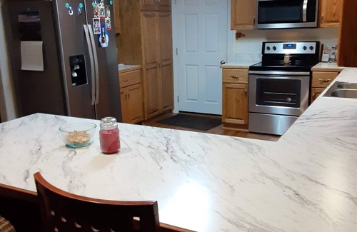 Madison Heights House | Welcome Home! New luxurious home awaits - large family room w/fireplace.