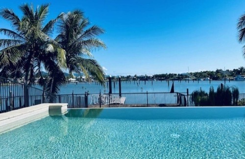 Cardwell House | Welcome to 'Hinchinbrook Escape' Waterfront Townhouse with Marina Berth Pool Spa