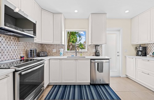 Poinsettia Heights House | Welcome to Pelican Landing, A Cozy Tropical Heated Pool Home!