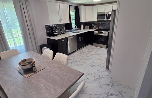Windsor Locks House | Welcome to The Hangar, a newly remodeled travel-themed stay, 4 minutes from BDL.