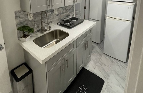 The Hammocks Apartment | welcoming you to a Bedroom kitchen and parking