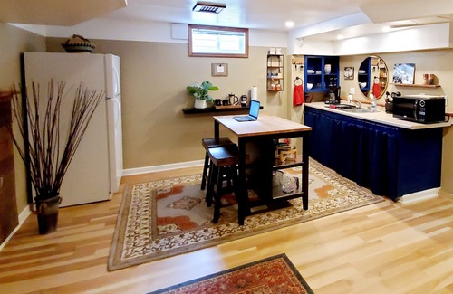 Concordia House | Well appointed basement guest suite with private entrance & backyard oasis.