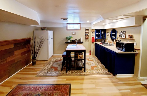 Concordia House | Well appointed basement guest suite with private entrance & backyard oasis.