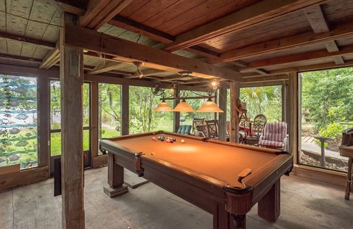 Crescent City House | West Stella Lake House with Outdoor Pool Table & Fireplace by RedAwning