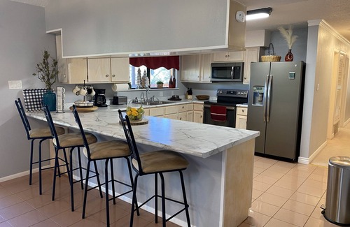 Ruidoso Cabin | Whispering Pines has great deck, hot tub & fire pit. Close to downtown & slopes.