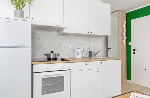 Brynow Apartment | White and Green Apartment by Renters