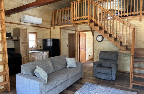 Johnson County Cabin | White cabin in the woods close to Univ. of Central Missouri and Whiteman AF Base