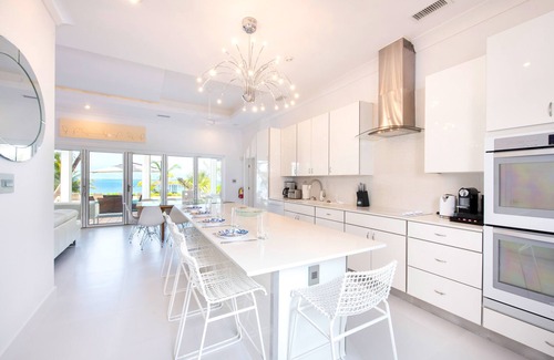 Breakers Villa | White Cottage: Deluxe Oceanfront Home w/Backyard Beachfront, Private Pool, Dock + Free Kayak