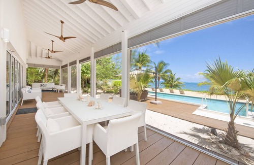 Breakers Villa | White Cottage: Deluxe Oceanfront Home w/Backyard Beachfront, Private Pool, Dock + Free Kayak