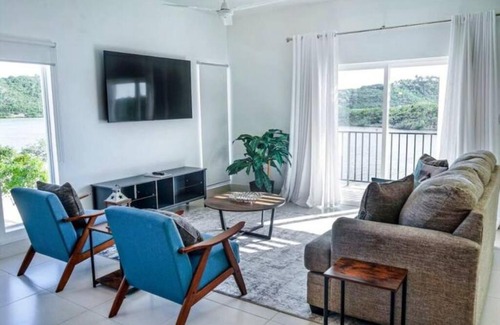 Venetian Road Settlement Villa | White Modern Flamingo Lake Villa