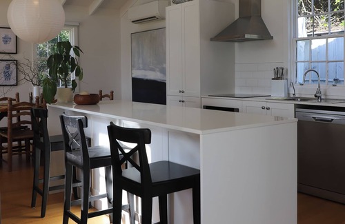 Falmouth House | White Shell Cottage | Wood fire & beachfront