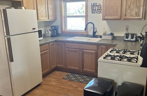 Rhinelander Cottage | WI River-Boom Lake cottage on spacious lot, water on 3 sides, kayaks, fire pit