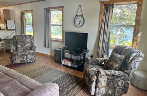 Rhinelander Cottage | WI River-Boom Lake cottage on spacious lot, water on 3 sides, kayaks, fire pit