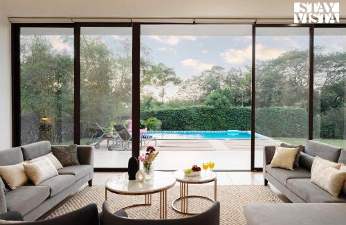Zirad Villa | Wildflower Villa by StayVista - Poolside retreat with contemporary interiors & indoor activities