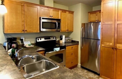 Golden Condo | Windfall Lodge: 2-bedroom condo with hot tub and mountain views