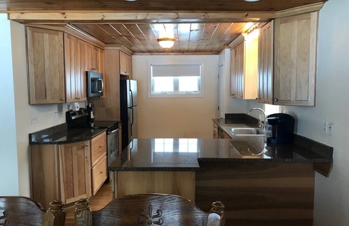 Alton Bay House | Winnipesaukee lakefront house includes slip, deck, hot tub & sleeps up to 11