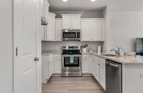 Thomas Drive House | Winter rental rates available! Close to Publix Sports Park! Community Pool!