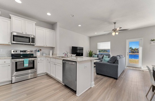 Thomas Drive House | Winter rental rates available! Close to Publix Sports Park! Community Pool!