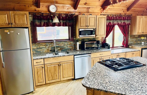 Champion House | Wooded cabin in the Laurel Highlands with beautiful yard and native trout stream