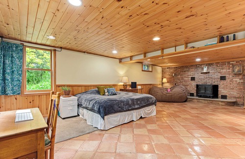 Plymouth House | Wooded lot with wildlife, indoor treehouse and screened porch: a family paradise