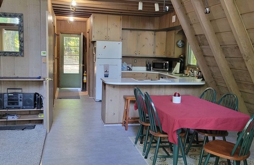Boyne City Ski Chalet | Wooded setting with view of Walloon Lake